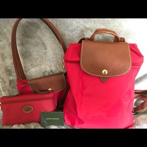 Longchamp backpack in red.